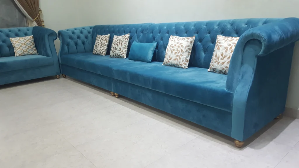 Blue couch and yellow Yellow and cushions.