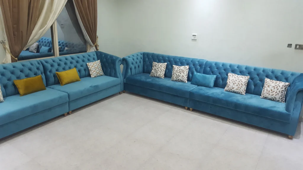 Blue couch and yellow Yellow and cushions.