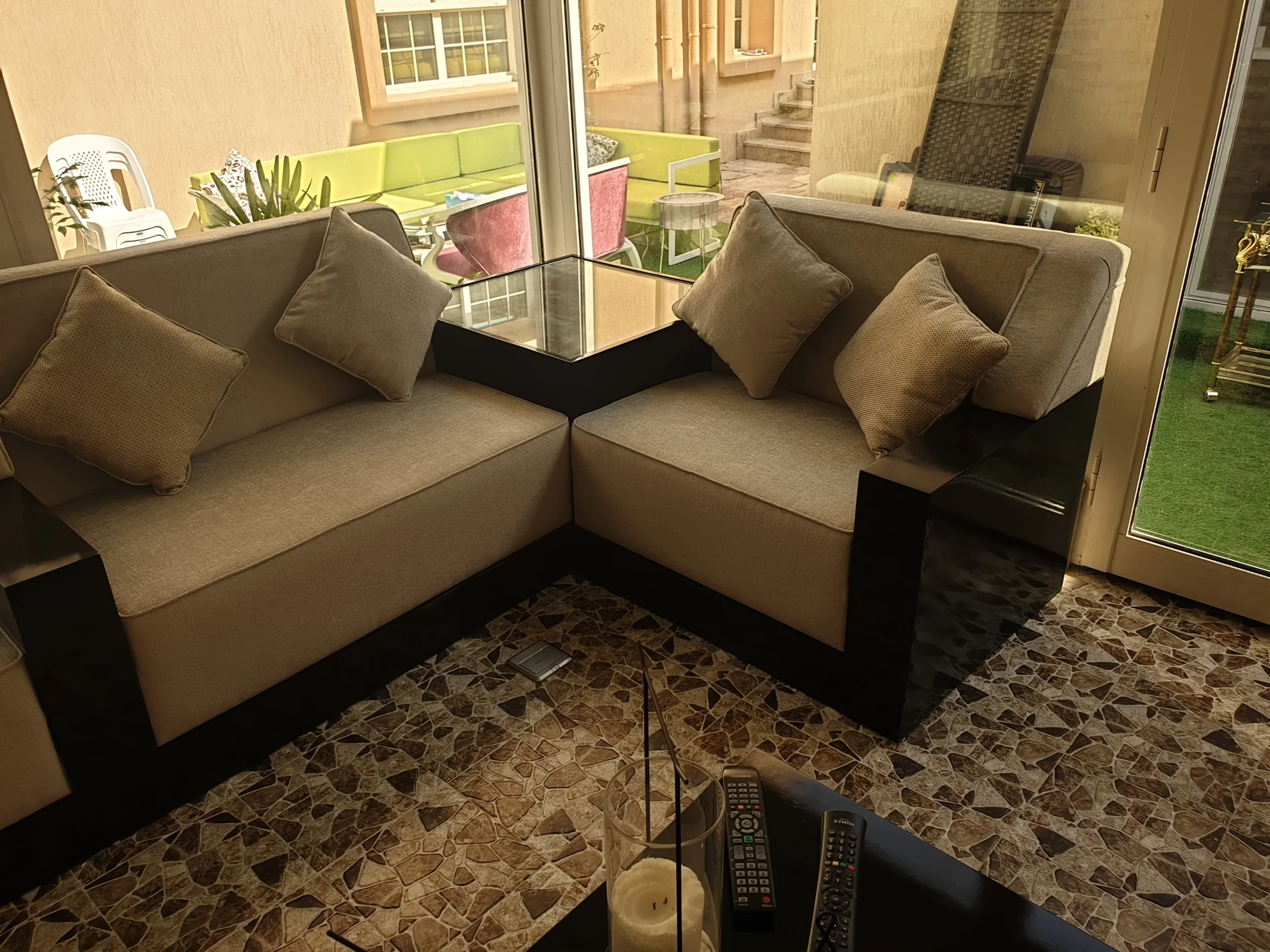 A well-furnished living room with a sofa and a modern coffee table.