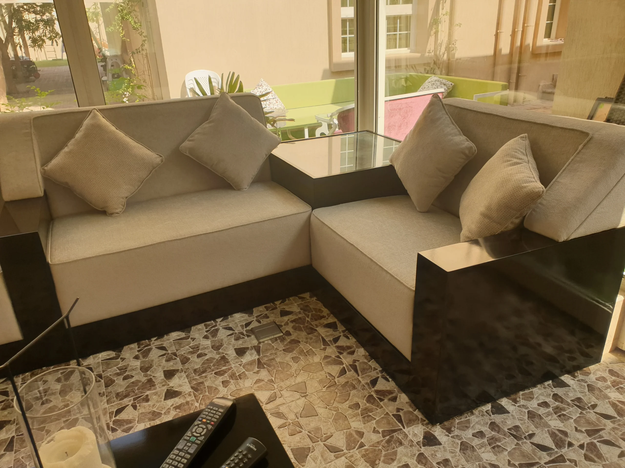 A well-furnished living room with a sofa and a modern coffee table.